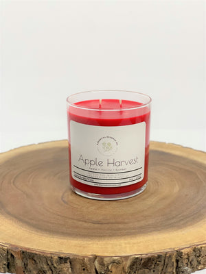 Find yourself transported to lush apple orchards laden with sweet, juicy apples ready for picking with this scented candle. The Apple Harvest is a comforting, nostalgic scent that blends crisp, fragrant apples with a little touch of sweet vanilla to fill your senses with a warm, festive feeling. With base notes of deep, spicy bourbon, this fresh, fruity scent reaches elevated levels of sophistication, making it a holiday favorite that you and your family will adore.